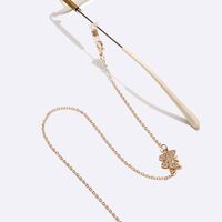 Gold-colored metal non-slip chain, with butterfly with rhinestines, for glasses and masks GL1456