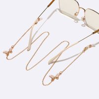 Gold-colored metal non-slip chain, with white butterfly, for glasses and masks GL1577