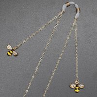 Gold-colored metal non-slip chain, with pendant bee with rhinestone, for glasses and masks GL373