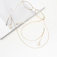 Gold-colored metal non-slip chain, with pendant flower, for glasses and masks GA017