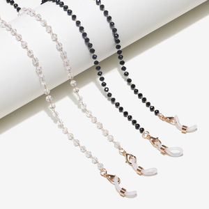 Set of two golden glasses chain with black and white crystals GM083