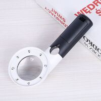 Magnifier with universal backlight, magnifying glass with handle 558L-XX, size: diameter 55 mm, magnification: 7X, 20X