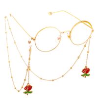 Gold-colored metal non-slip chain, with pendant red rose and beads, for glasses and masks GL554