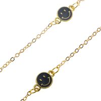 Gold-colored metal non-slip chain, with black smiley, for glasses and masks GL088