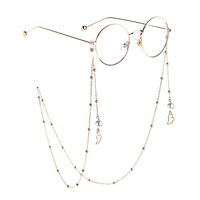 Gold-colored metal non-slip chain, with pendant wings of angel and pearl, for glasses and masks GL817