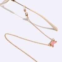 Gold-colored metal non-slip chain, with pink butterfly, for glasses and masks GL1576