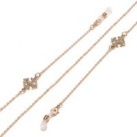 Gold-colored metal non-slip chain, with cross with rhinestone, for glasses and masks GL1445