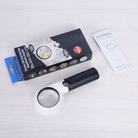 Magnifier with universal backlight, magnifying glass with handle 558L-XX, size: diameter 55 mm, magnification: 7X, 20X