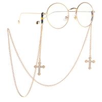 Gold-colored metal non-slip chain, with pendant cross with rhinestones, for glasses and masks GL022