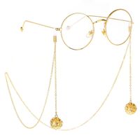 Gold-colored metal non-slip chain, with pendant hollow ball and rhinestone, for glasses and masks GL252