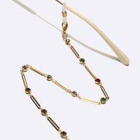 Gold-colored metal non-slip chain, with olval and colorful rhinestones, for glasses and masks GL1629