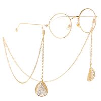 Gold-colored metal non-slip chain, with pendant hollow leaf, for glasses and masks GL241
