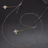 Gold-colored metal non-slip chain, with pendant leaf and pearl, for glasses and masks GL548